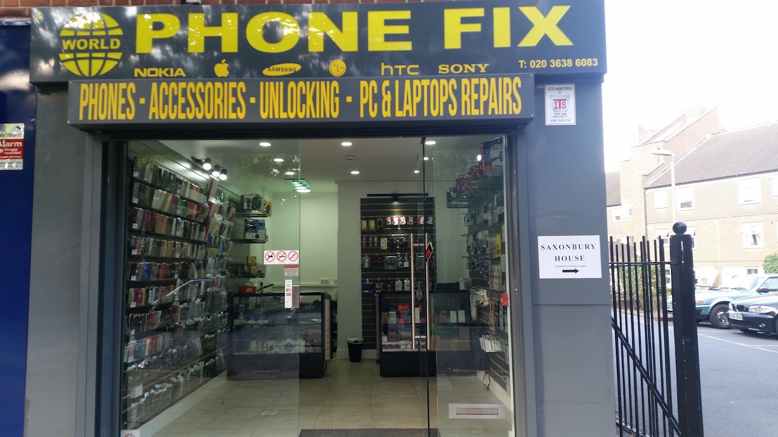 The bright yellow World Phone Fix shopfront on Leytonstone High Street, sign reading Phones, Accessories, Unlocking, PC and Laptop Repairs.